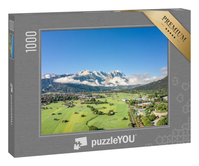 Puzzle 1000 Teile „Garmisch-Partenkirchen mit Blick auf die Zugspitze im Nebel“