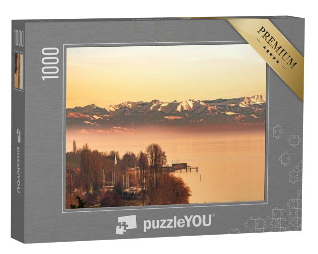 Puzzle 1000 Teile „Abendleuchten am Bodensee mit Schweizer Alpen“