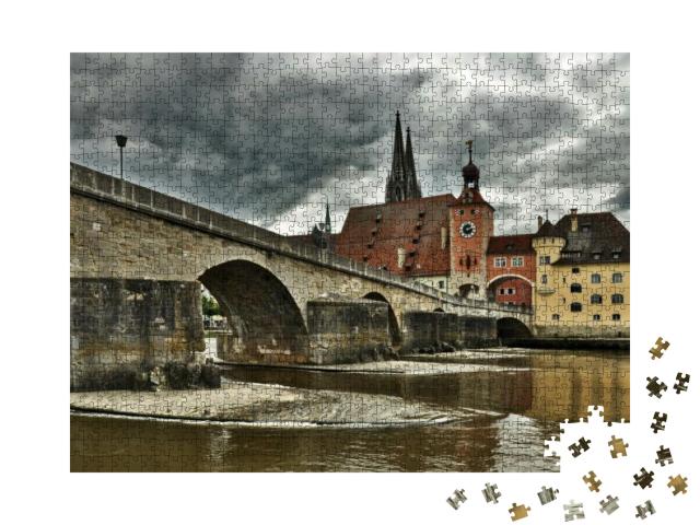 Puzzle 1000 Teile „Regensburg mit Steinbrücke und Dom St. Peter“