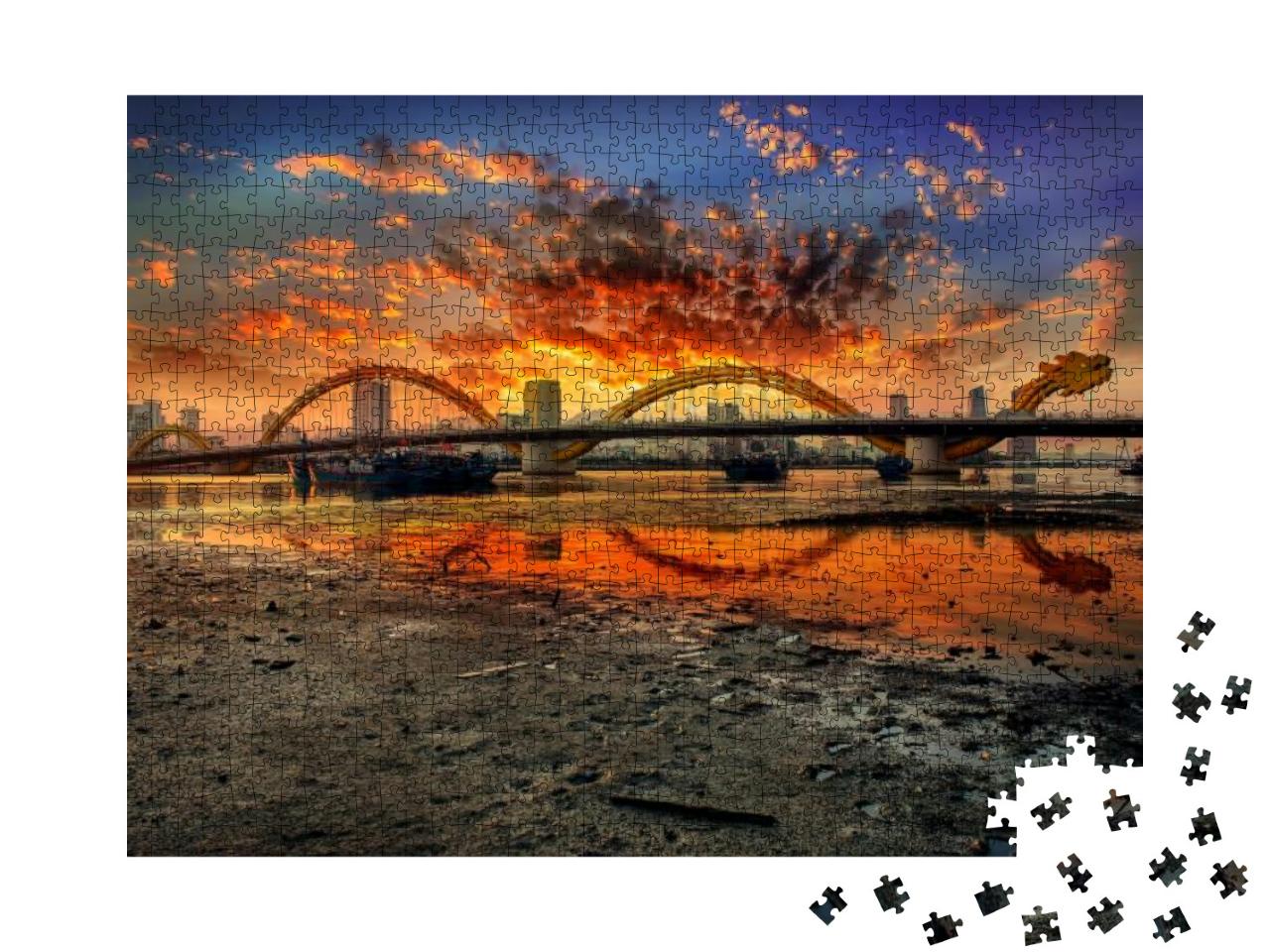 Puzzle 1000 Teile „Drachenbrücke bei Sonnenuntergang: Bild aus Da Nang, Vietnam“