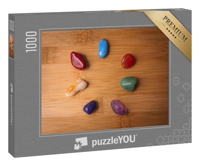 Puzzle 1000 Teile „Sieben Chakra-Steine in einem Holztisch“