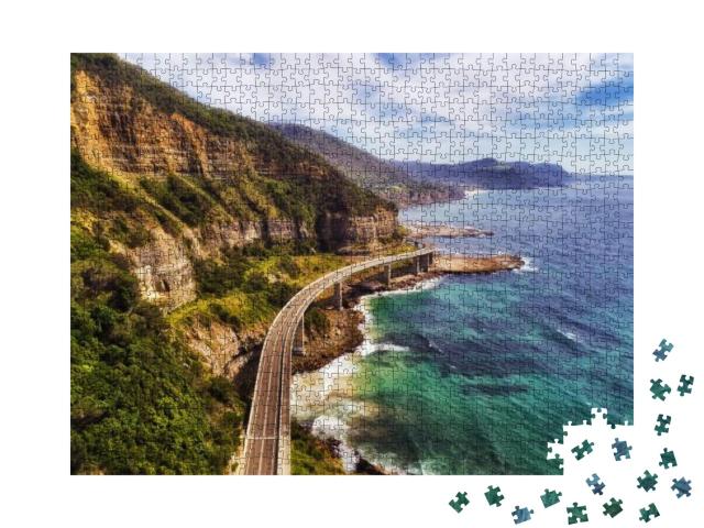 Puzzle 1000 Teile „Seeklippenbrücke auf dem Grand Pacific Drive, Australien“