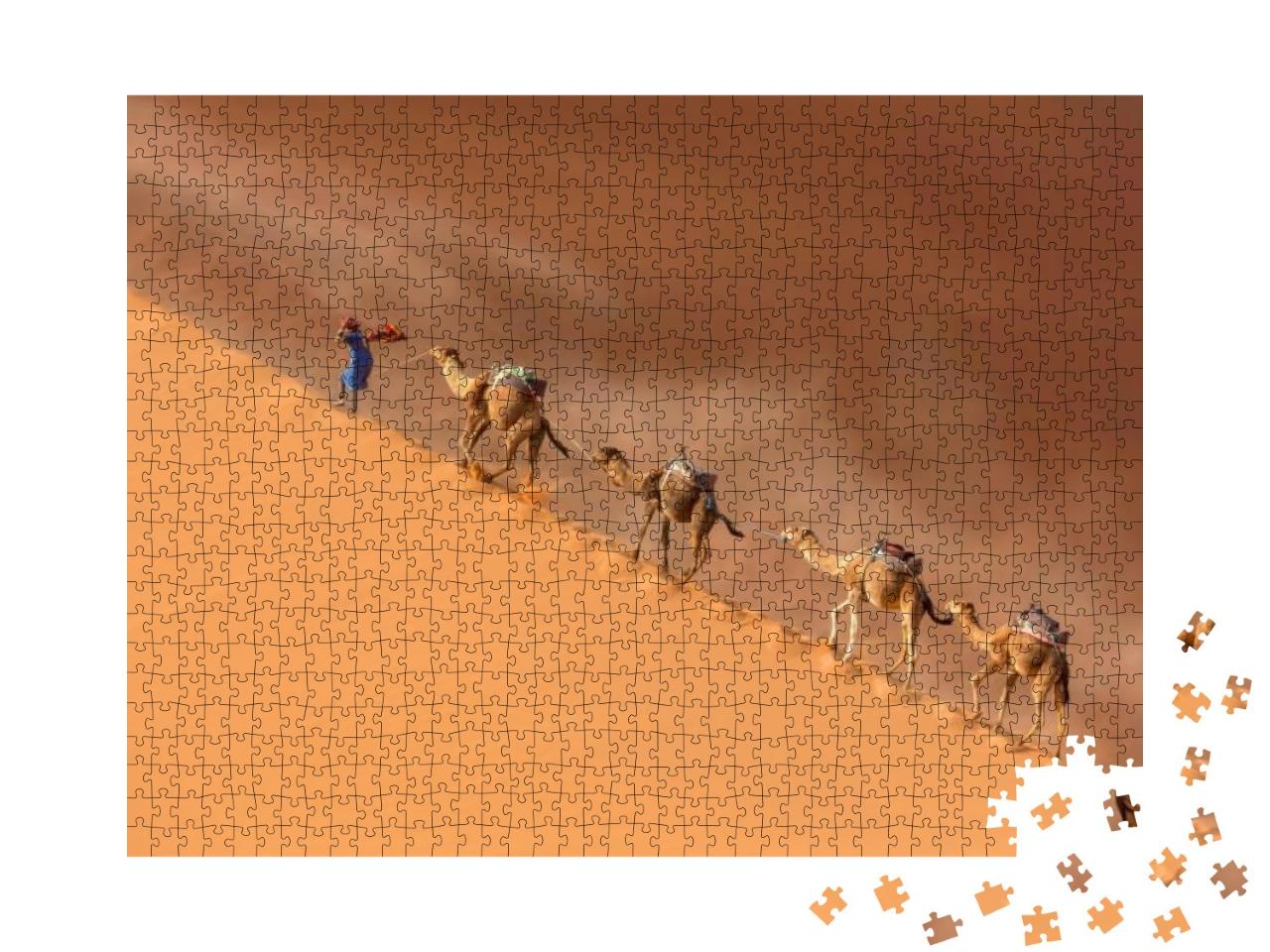Puzzle 1000 Teile „Kamelkarawane in der Wüste Sahara während eines Wüstensturms“