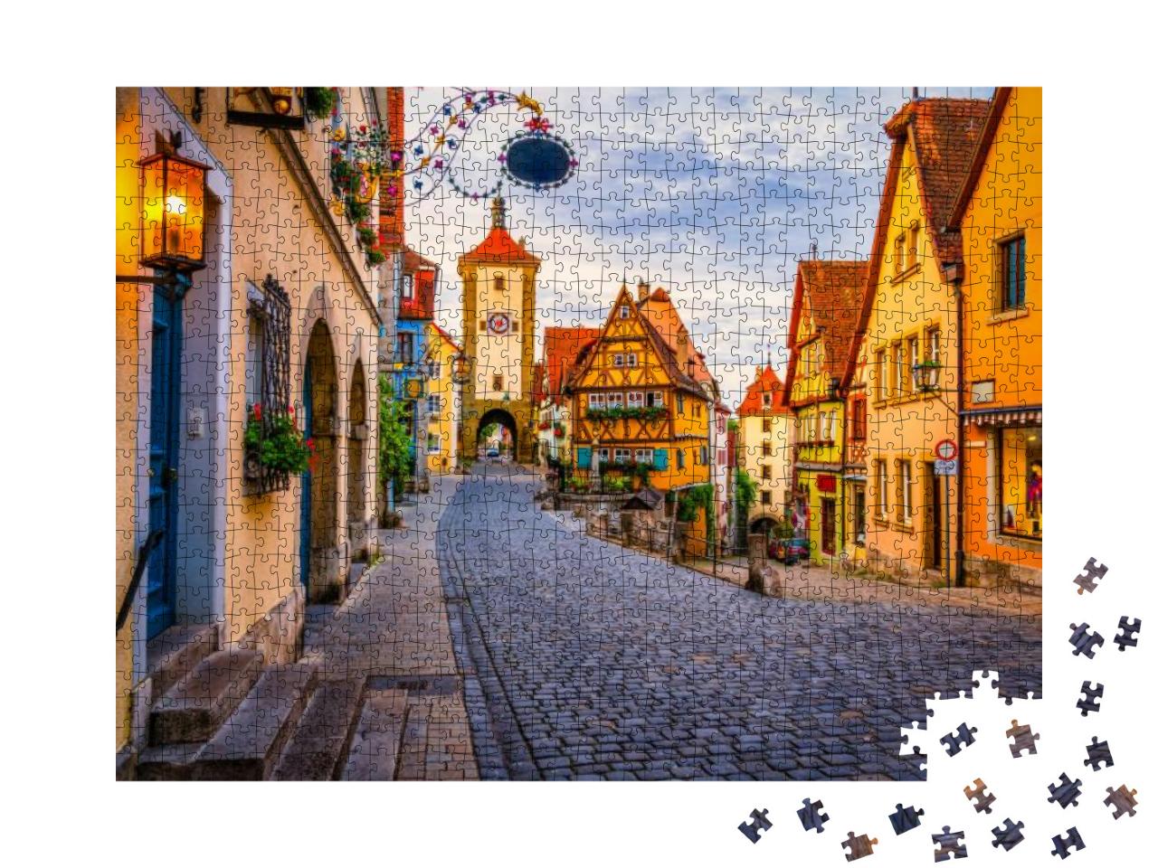 Puzzle 1000 Teile „Morgenansicht der Unteren Schmiedgasse in Rothenburg ob der Tauber, Bayern“