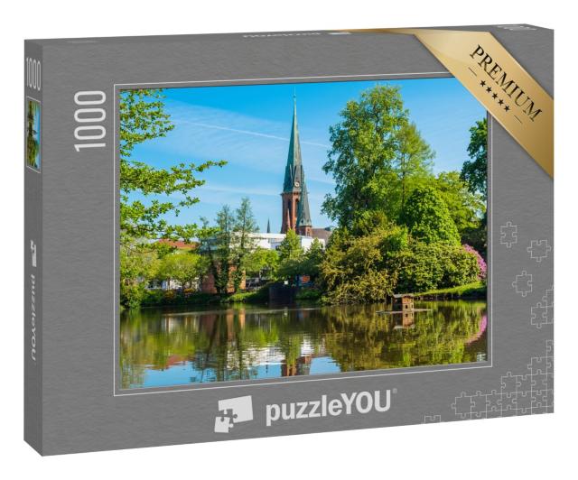Puzzle 1000 Teile „Blick auf den Teich und die St. Lamberti Kirche in Oldenburg, Deutschland“