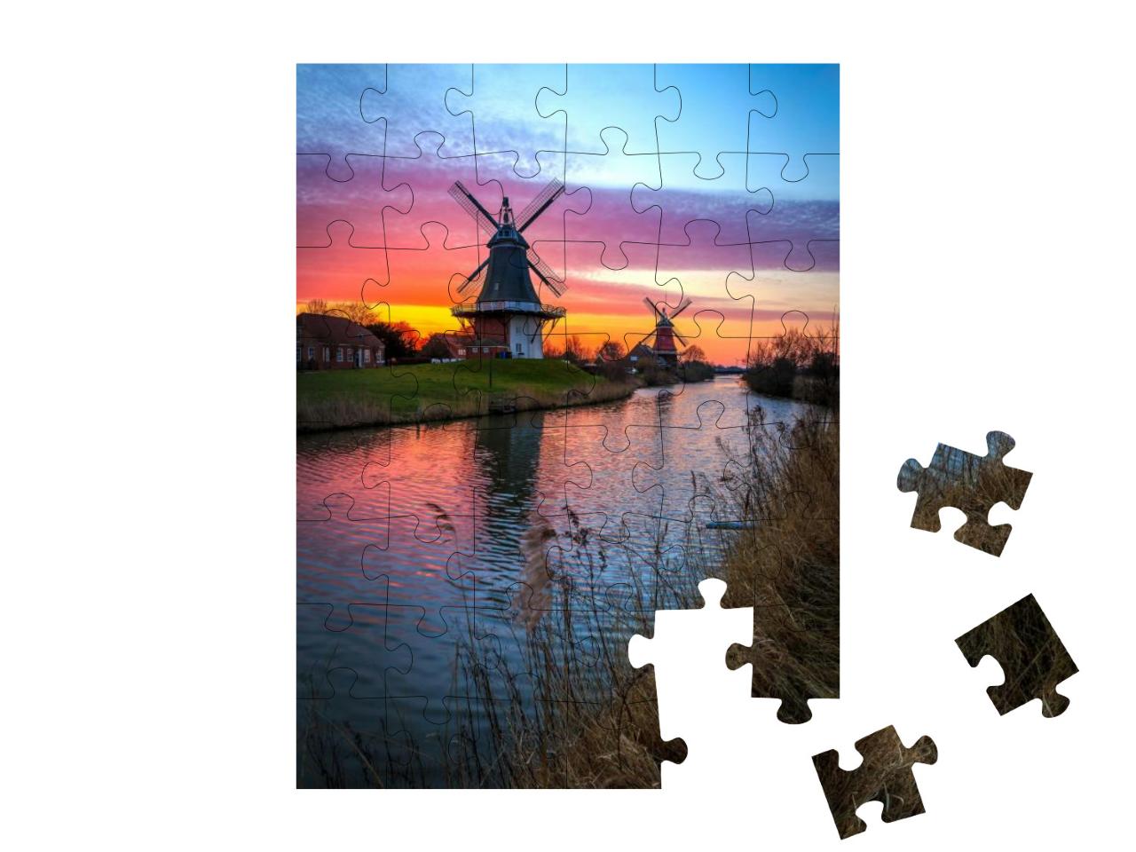 Puzzle 48 Teile „Zwillingsmühlen von Greetsiel, Ostfriesland bei Sonnenaufgang“