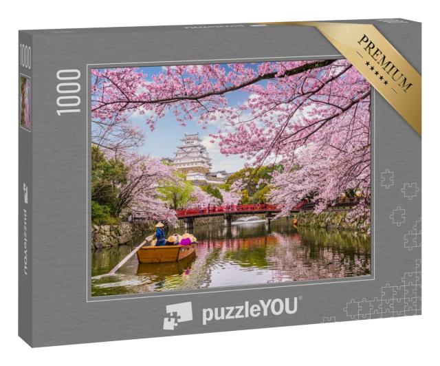 Puzzle 1000 Teile „Majestätische Burg über der Stadt Himeji während der Kirschblüte in Japan“