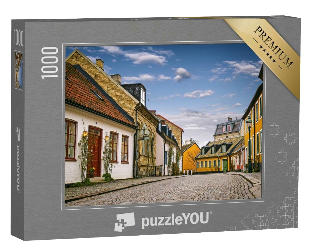Puzzle 1000 Teile „Straße mit alten Gebäuden, Innenstadt von Lund, Schweden“