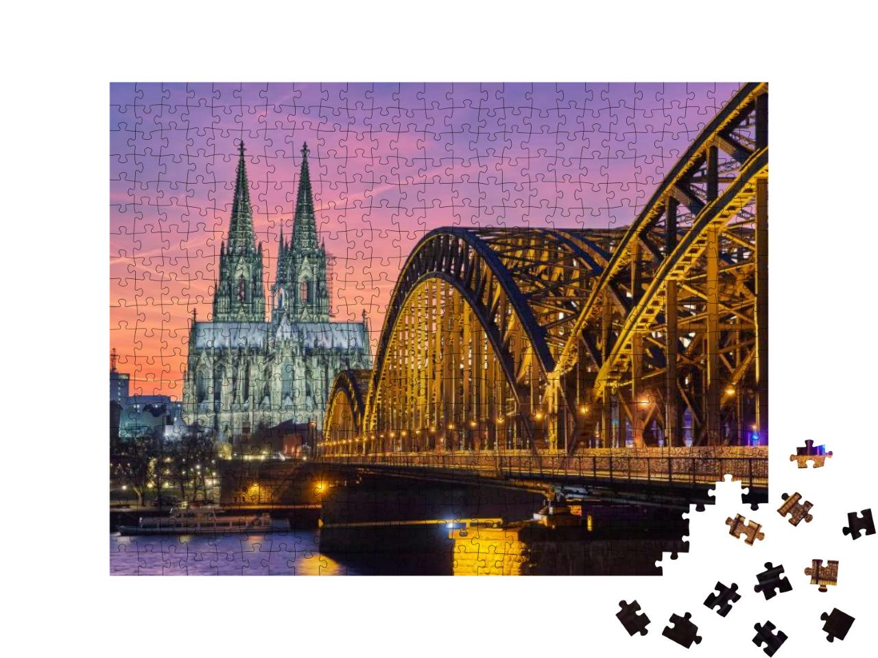 Puzzle 500 Teile „Kölner Dom und Hohenzollernbrücke bei Sonnenuntergang“