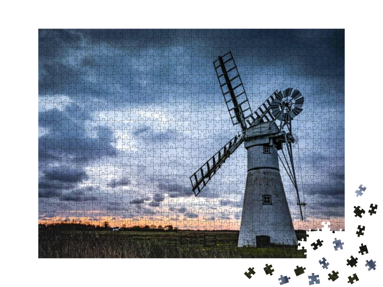 Puzzle 1000 Teile „Eine Mühle auf einem Feld mit Sonnenuntergang“