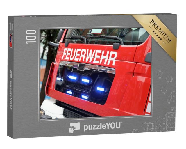 Puzzle 100 Teile „Deutsches Feuerwehrauto in Aktion“