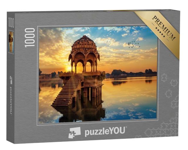 Puzzle 1000 Teile „Sonnenuntergang vor den Ruinen von Gadi Sagar, Indien“