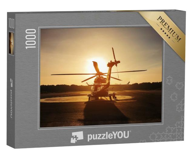 Puzzle 1000 Teile „Hubschrauber auf dem Landeplatz im Sonnenuntergang“