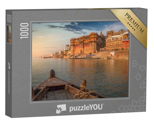 Puzzle 1000 Teile „Tempel und Gebäude am Fluss Ganges bei Sonnenuntergang“
