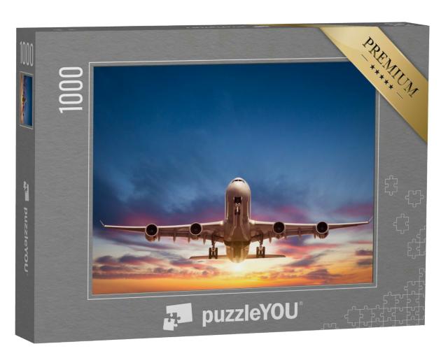 Puzzle 1000 Teile „Passagierflugzeug auf dem Flug in den Sonnenuntergang“