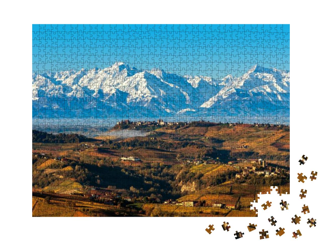 Puzzle 1000 Teile „Blick von oben auf herbstliche Hügel und schneebedeckte Berge“