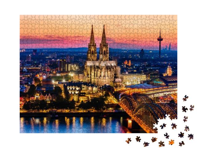 Puzzle 1000 Teile „Nachtpanorama des Kölner Doms, der Hohenzollernbrücke und des Rheins“