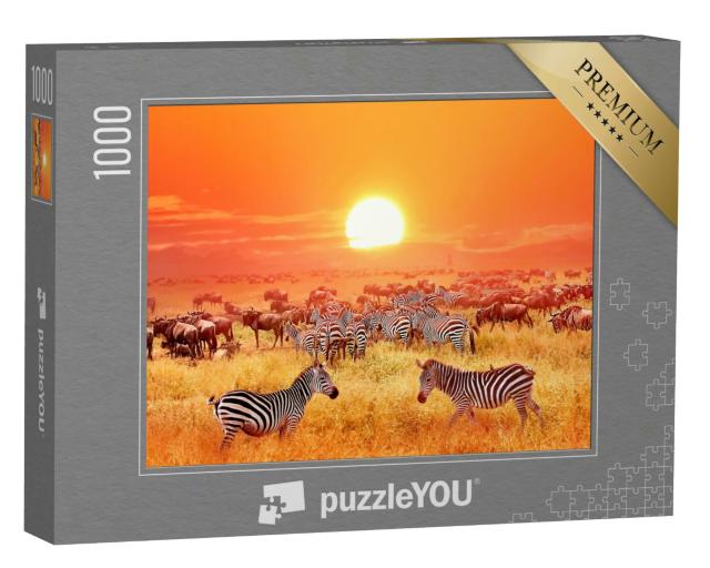 Puzzle 1000 Teile „Zebras und Antilopen bei Sonnenuntergang im Serengeti-Nationalpark“