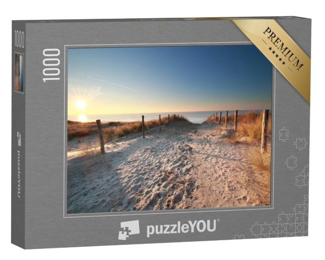 Puzzle 1000 Teile „Sonnenlicht über einem Sandweg zum Nordseestrand, Holland“