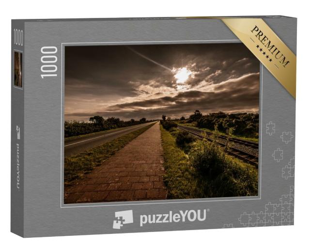Puzzle 1000 Teile „Malerischer Blick auf Schienen und Straße in Borkum“