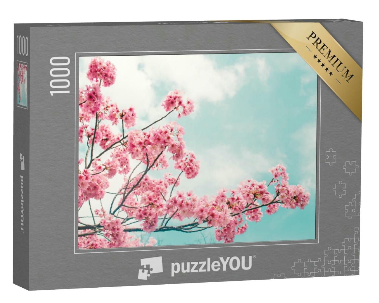Puzzle 1000 Teile „Wunderschön blühender Kirschblütenzweig vor blauen Himmel“