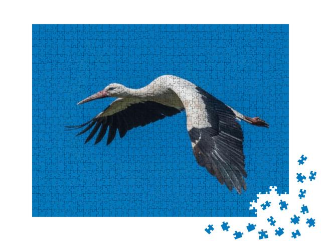 Puzzle 1000 Teile „Fliegender Weißstorch am blauen Himmel“