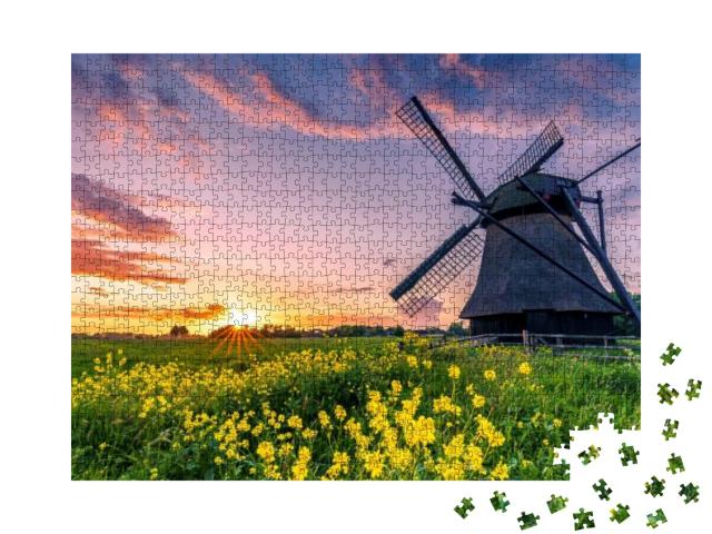 Puzzle 1000 Teile „Wasserschaufelmühle auf einem Feld in Ostfriesland, Norddeutschland“