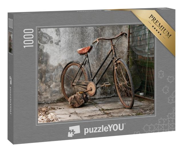 Puzzle 1000 Teile „Altes rostiges Fahrrad vor einer Mauer“