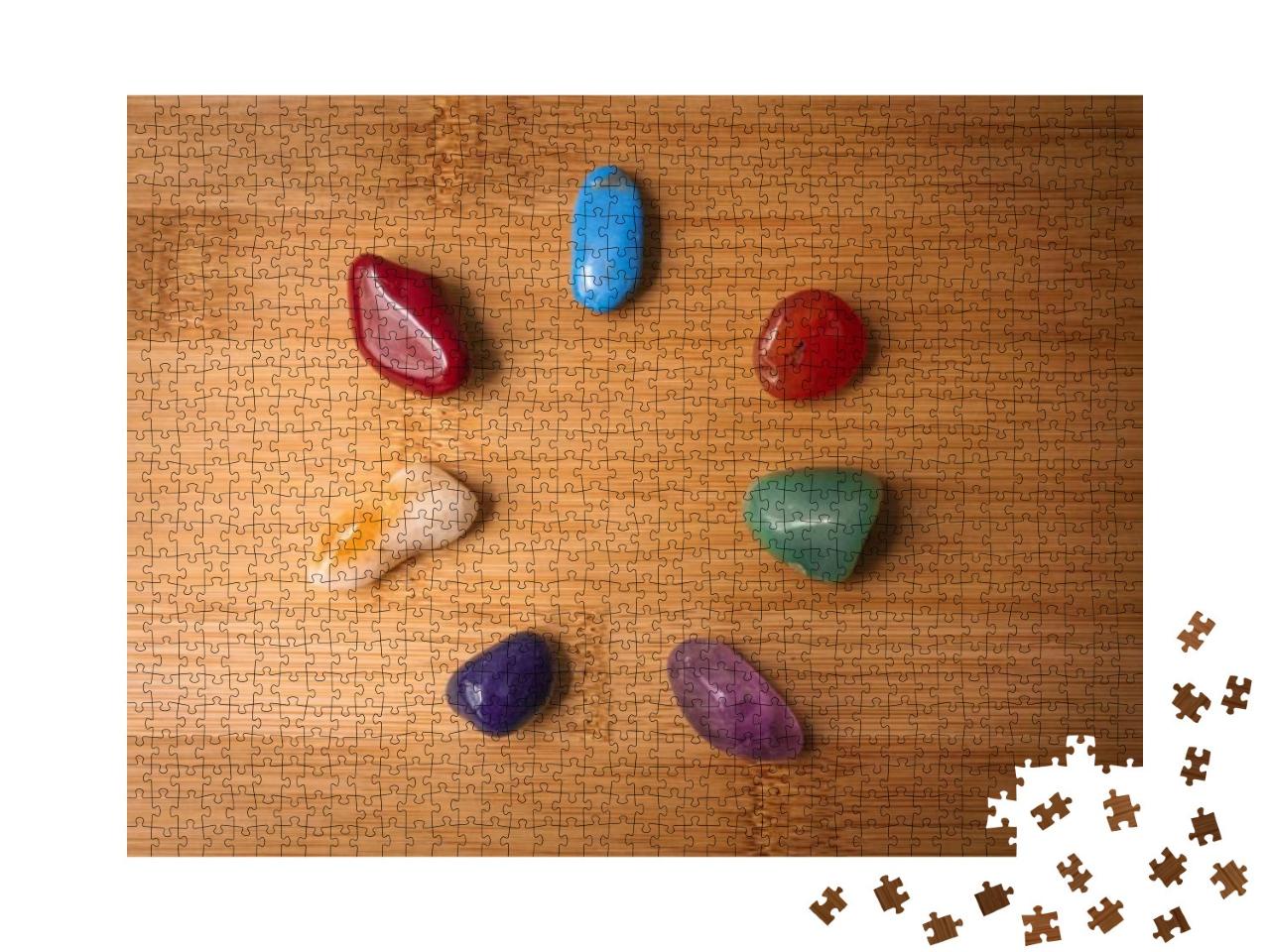 Puzzle 1000 Teile „Sieben Chakra-Steine in einem Holztisch“