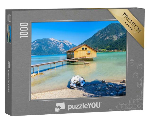 Puzzle 1000 Teile „Bootshaus am Ufer des Achensees, Österreich“
