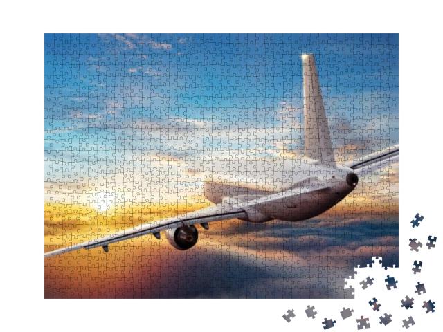 Puzzle 1000 Teile „Flug in den Sonnenuntergang über den Wolken“