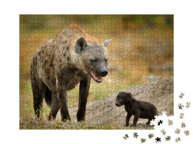 Puzzle 1000 Teile „Neugeborenes Hyänen-Junges mit seiner Mutter, Okavango, Botswana“