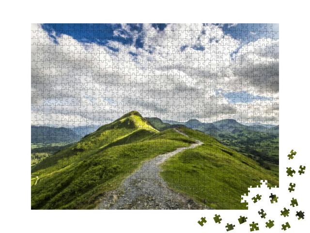 Puzzle 1000 Teile „Blick auf die Catbells-Hügelspitze im Lake District, England“