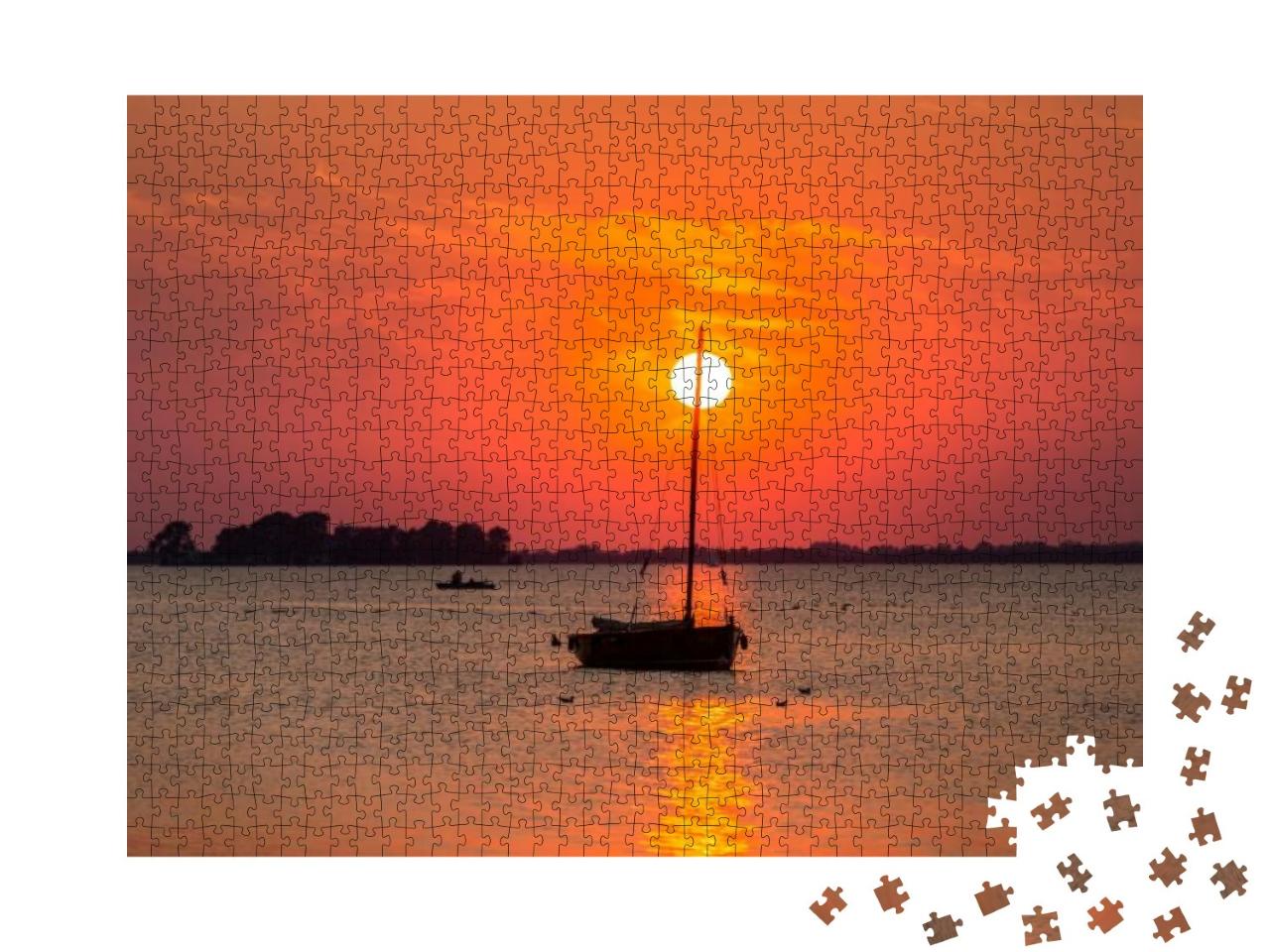 Puzzle 1000 Teile „Sonnenuntergang am Steinhuder Meer: Boot im roten Licht, Niedersachsen“