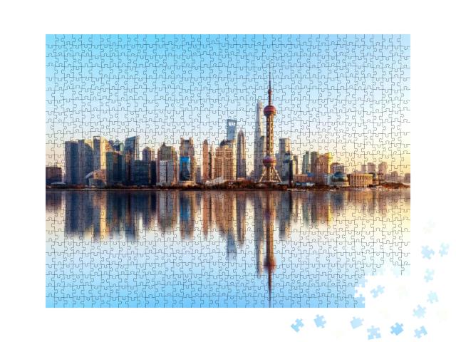 Puzzle 1000 Teile „Skyline von Shanghai mit Wasserreflektion“