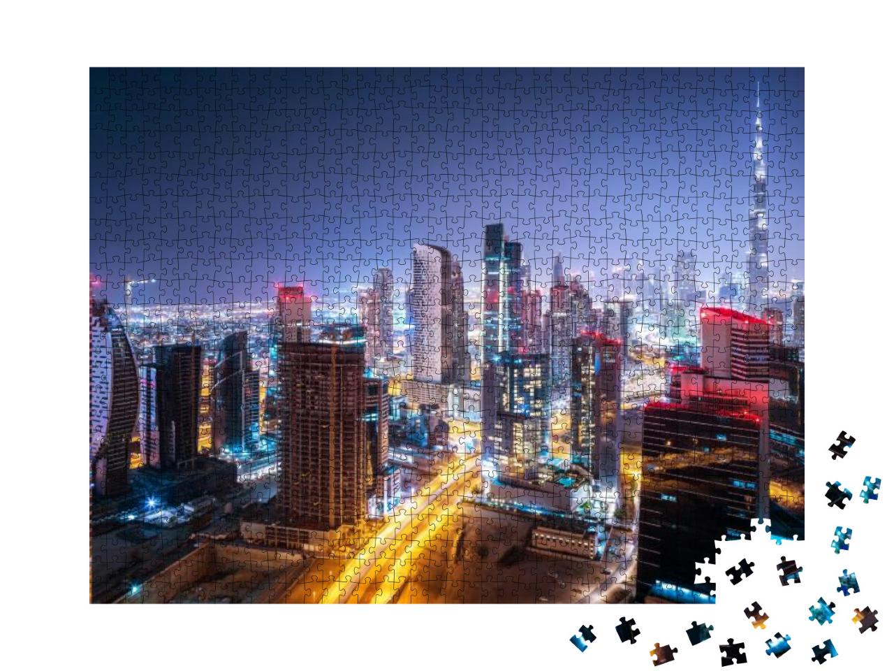 Puzzle 1000 Teile „Bei Nacht: Stadtbild von Dubai, Vereinigte Arabische Emirate“