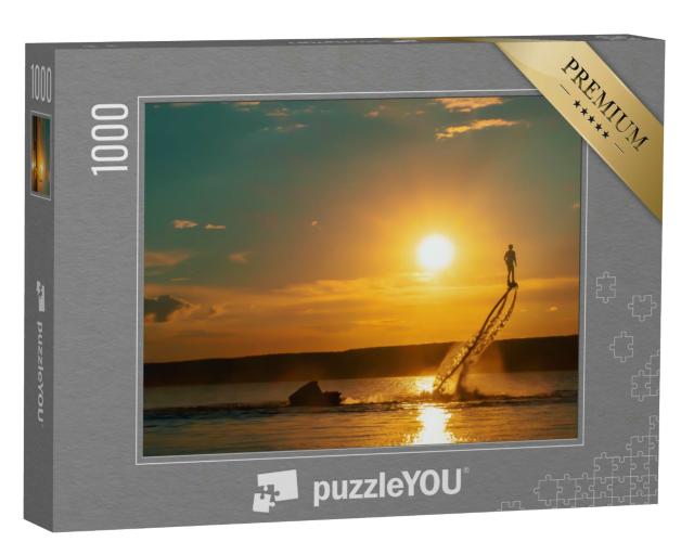 Puzzle 1000 Teile „Flyboarding im Sonnenuntergang über dem Meer“