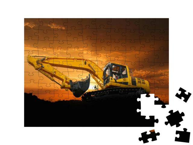 Puzzle 100 Teile „Crawler Bagger auf einer Baustelle bei Sonnenuntergang“