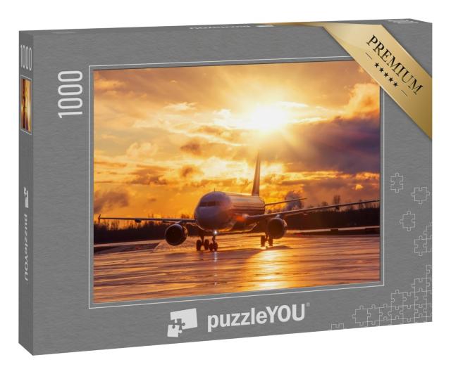 Puzzle 1000 Teile „Flugzeug auf der Landebahn im glühenden Sonnenuntergang“
