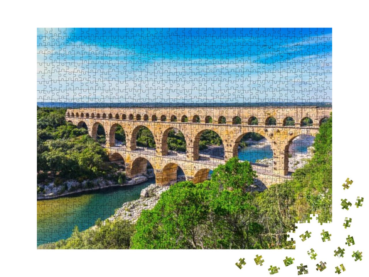 Puzzle 1000 Teile „Das dreistufige Aquädukt Pont du Gard wurde in römischer Zeit am Fluss Gardon gebaut“