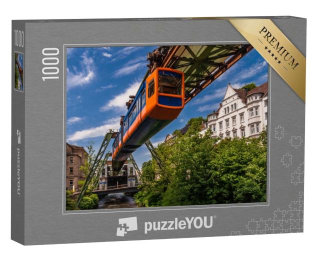 Puzzle 1000 Teile „Die Schwebende Straßenbahn in Wuppertal“