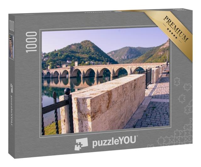 Puzzle 1000 Teile „Brücke über den Fluss Drina, Bosnien“