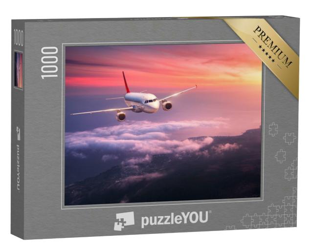 Puzzle 1000 Teile „Passagierflugzeug beim Flug durch den roten Abendhimmel“