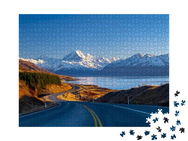 Puzzle 1000 Teile „Straße entlang des Lake Pukaki zum Mount Cook National Park, Neuseeland“