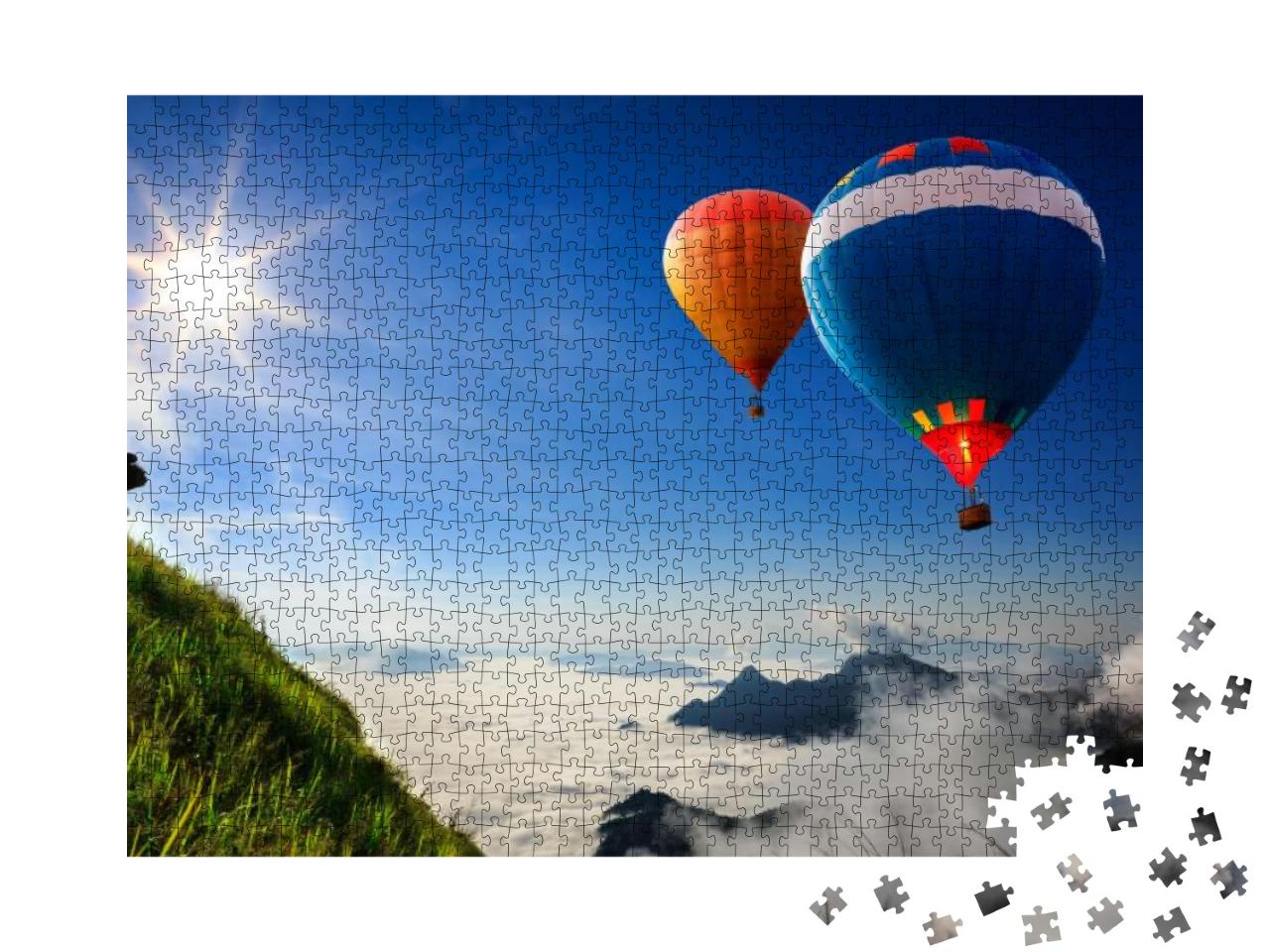 Puzzle 1000 Teile „Bunte Heißluftballons über Berggipfeln im Nebel“