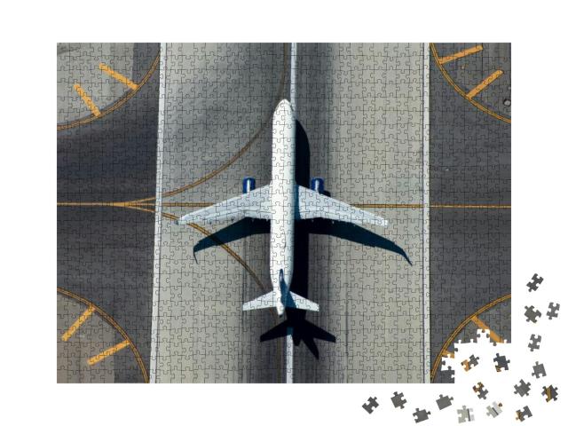 Puzzle 1000 Teile „Schmalrumpfflugzeug auf der Landebahn“