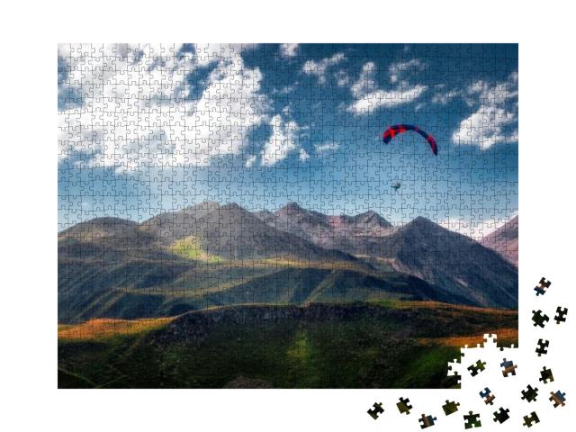 Puzzle 1000 Teile „Gleitschirm über den Bergen“