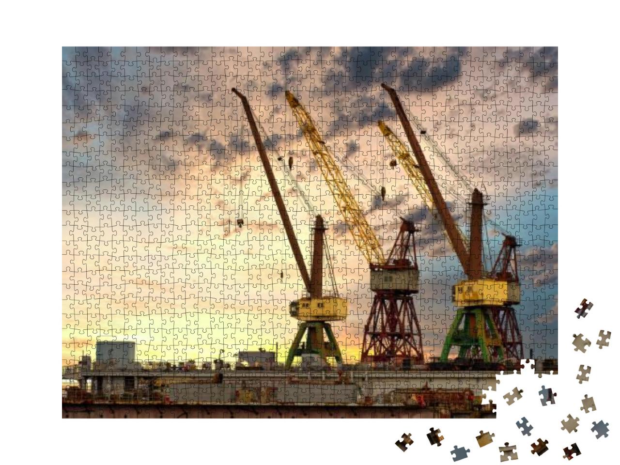 Puzzle 1000 Teile „Riesige blaue, orange und gelbe Kräne im Hafen“