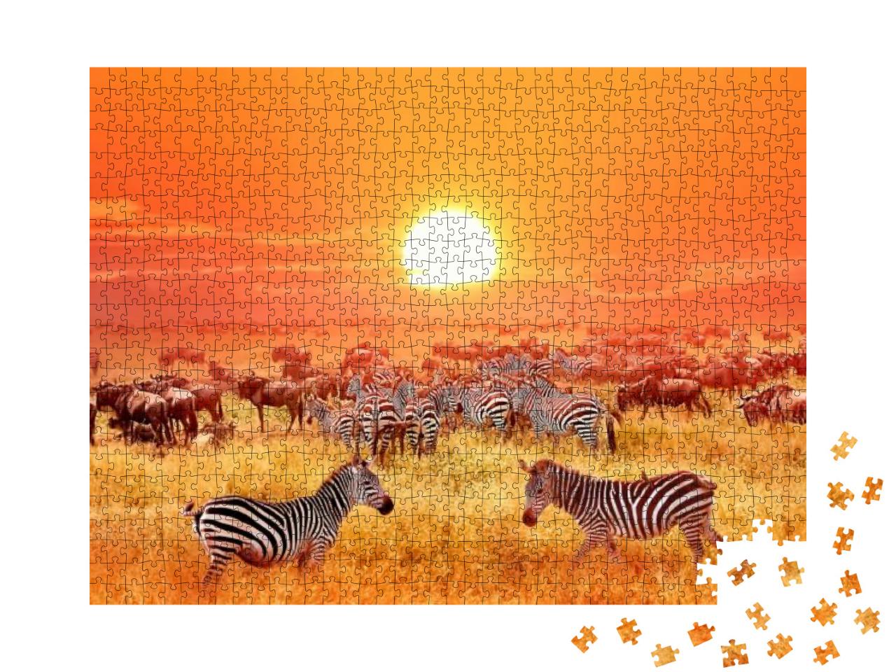 Puzzle 1000 Teile „Zebras und Antilopen bei Sonnenuntergang im Serengeti-Nationalpark“