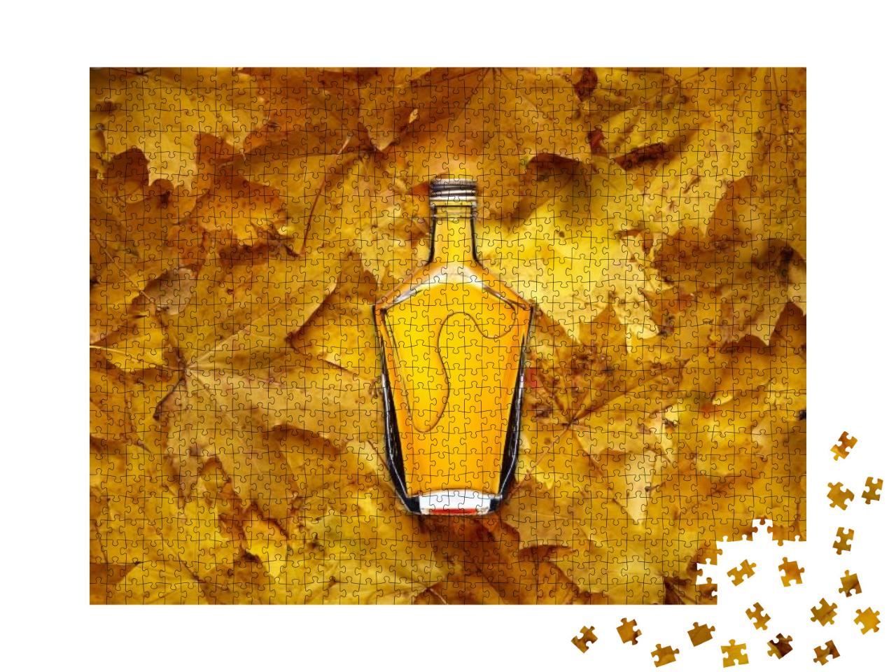 Puzzle 1000 Teile „Weinbrandflasche auf gelben Ahornblättern“